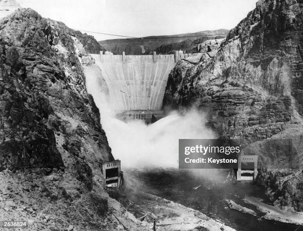 The Boulder Dam on the Arizona - Nevada border . It harnessed water from the Colorado River for use in power generation.
