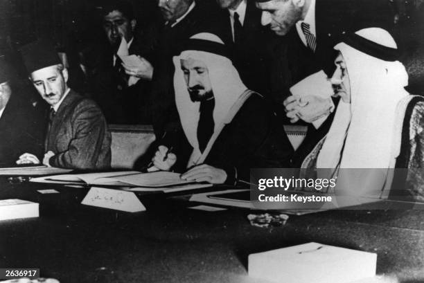 Delegates from Egypt, Iraq, Syria, the Lebanon, Saudi Arabia and Trans-Jordan signing the Arab League Charter.