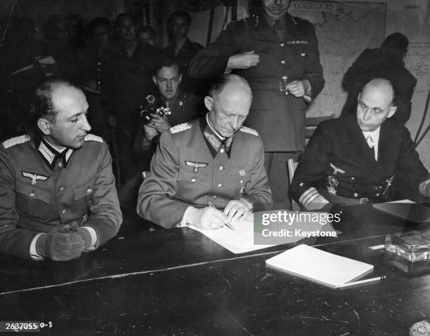 General Alfred Jodl Hitler's military advisor, controller of German High Command and chief of the Operations Staff , signs the document of surrender...