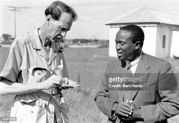 Tshekedi Khama, , right, chief regent of the Bamangwato from 1925, chief of Bechuanaland and uncle of Seretse Khama, talking to journalist Fyfe...