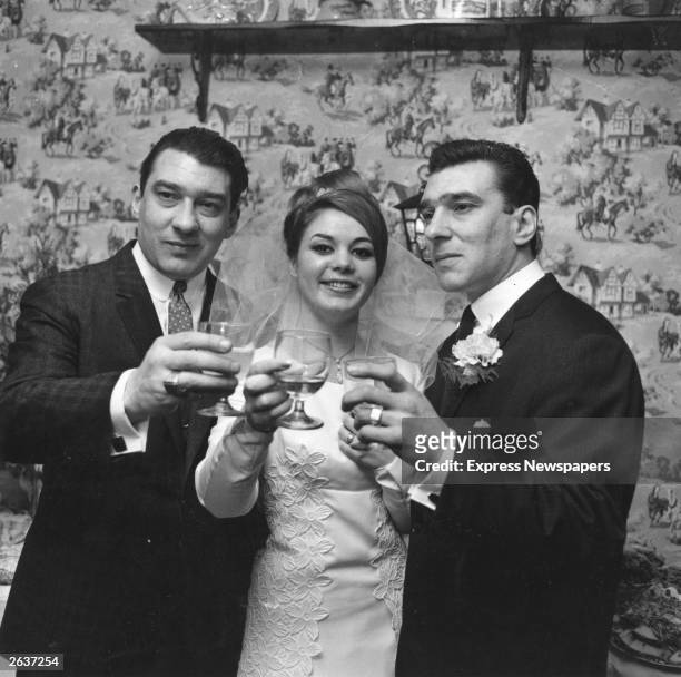 English gangsters Ronald and Reginald Kray, the Kray Twins, with Frances Shae, at her wedding to Reggie. Original Publication: People Disc - HF0516