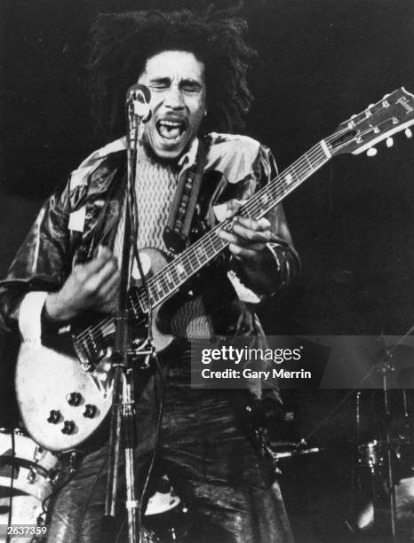 Reggae singer-songwriter Bob Marley , in concert.