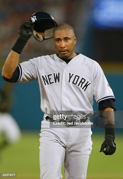 Bernie Williams of the New York Yankees walks back to the dugout after being left stranded on base in the sixth inning against the Florida Marlins...