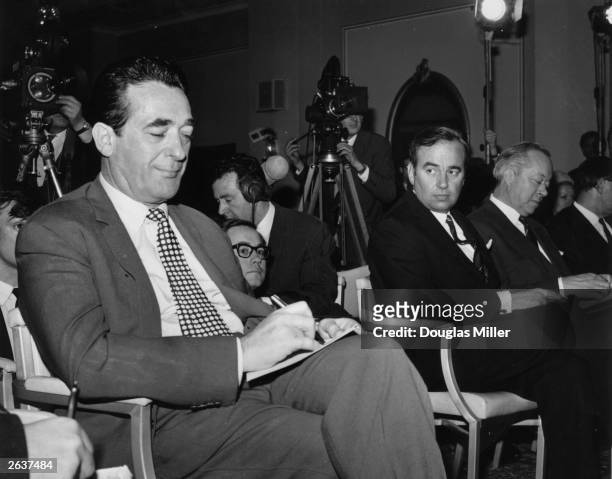 Newspaper magnates Robert Maxwell and Rupert Murdoch during voting on the News Of The World takeover.