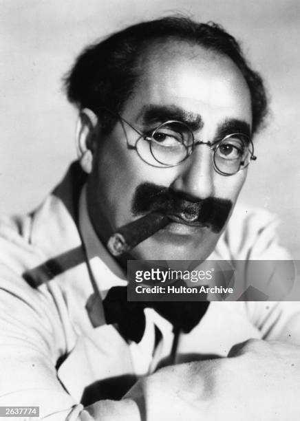 Julius 'Groucho' Marx , one of the Marx brothers, an American comic group.