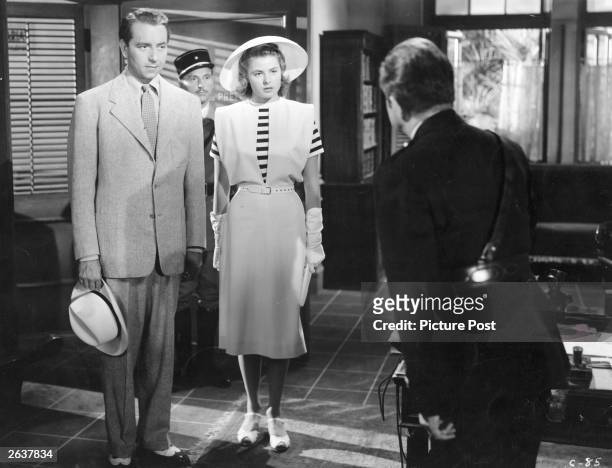 Ingrid Bergman and Paul Henreid meet Claude Rains in a scene from the film 'Casablanca', directed by Michael Curtiz for Warner Brothers. Original...