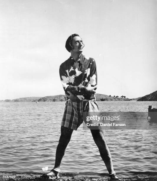 Spanish surrealist artist Salvador Dali on the beach outside his villa at Port Lligat near Cadaques on the Spanish coast. Original Publication:...