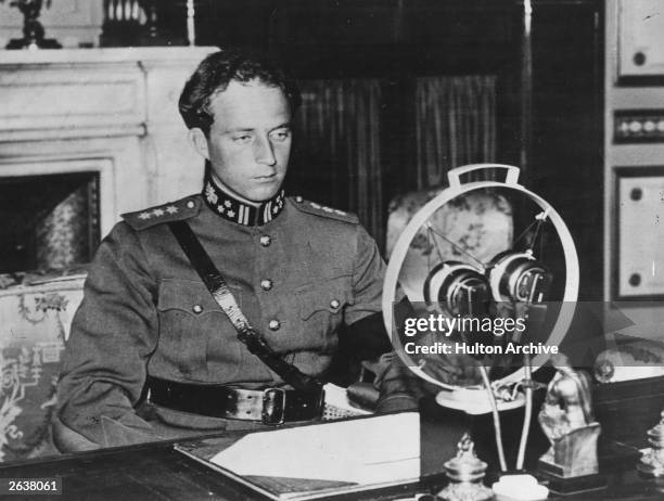 King Leopold III of Belgium making a broadcast speech at the microphone, possibly close to the time of the invasion of Belgium.