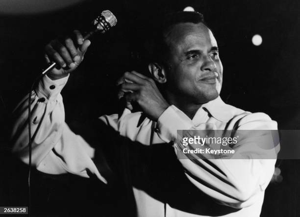 The 'King of Calypso', American singer and actor Harry Belafonte, performs to an audience of over 6,000 at the Circus Krone Bau, Munich.