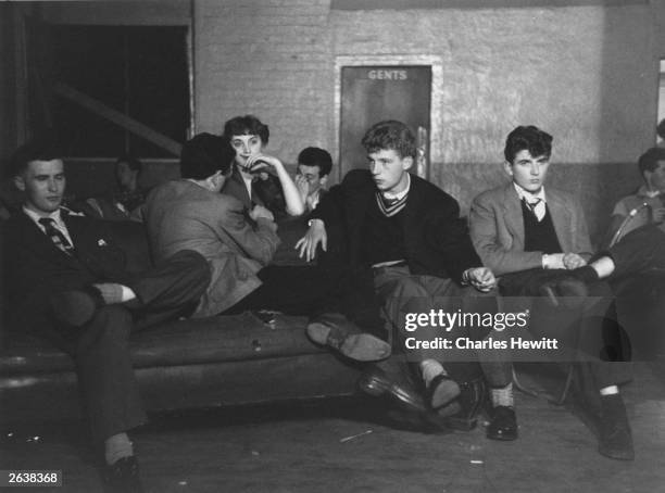 Young jazz fans in the basement of Cy Laurie's jazz club. Original Publication: Picture Post - 7208 - Blue Heaven In The Basement - pub. 1954