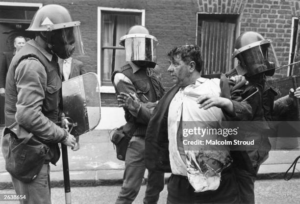 Catholics are killed, 60 injured and hundreds of homes devastated when the British Army impose a curfew in the Falls Road, Belfast, 3rd July 1970.