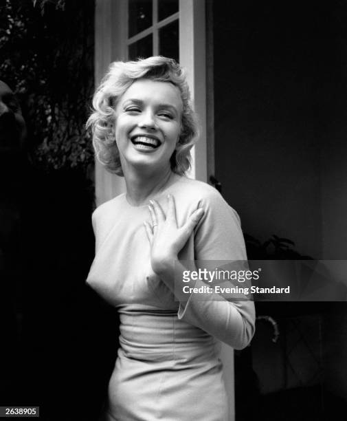 American film star Marilyn Monroe outside her home at Englefield Green.