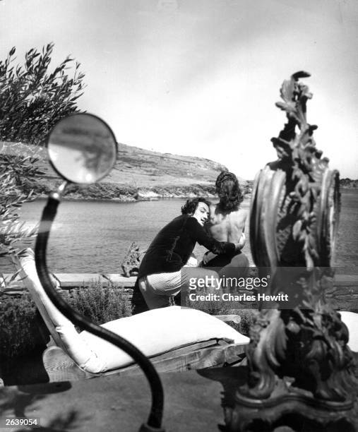 Spanish surrealist artist Salvador Dali with his wife Gala at the garden of his home in Cadaques on the Spanish Costa Brava. Original Publication:...