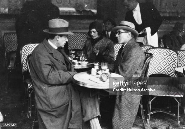 Walter Adolf Gropius , the German born American architect, his wife and Le Corbusier at the 'Cafe des Deux Magots' in Paris.