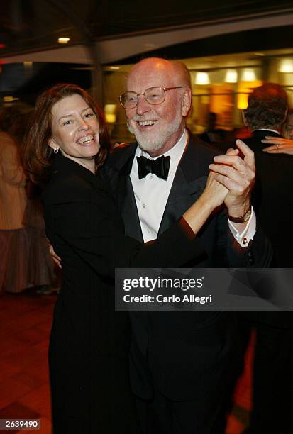 Composer John Williams and wife Samantha pose at the afterparty for the Walt Disney Concert Hall opening gala, day one of three, October 23, 2003 in...