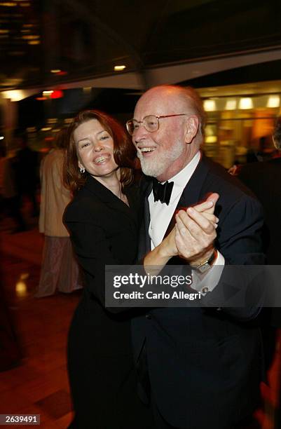 Composer John Williams and wife Samantha pose at the afterparty for the Walt Disney Concert Hall opening gala, day one of three, October 23, 2003 in...