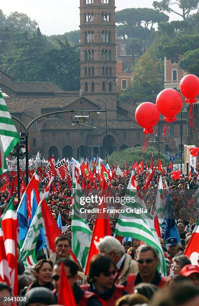 Thousands of people demonstrate against pension reforms planned by the government of Italian President Silvio Berlusconi October 24, 2003 in Rome,...