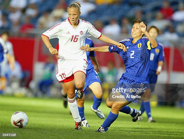 Midfielder Brittany Timko of Canada handles the ball as defender Yumi Obe of Japan defends during their first round match of the FIFA Women's World...