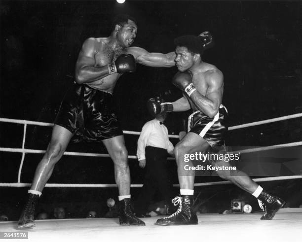 Archie Moore fighting Yolande Pompey of Trinidad at the Light Heavyweight Championship of the World fight held at Harringay.