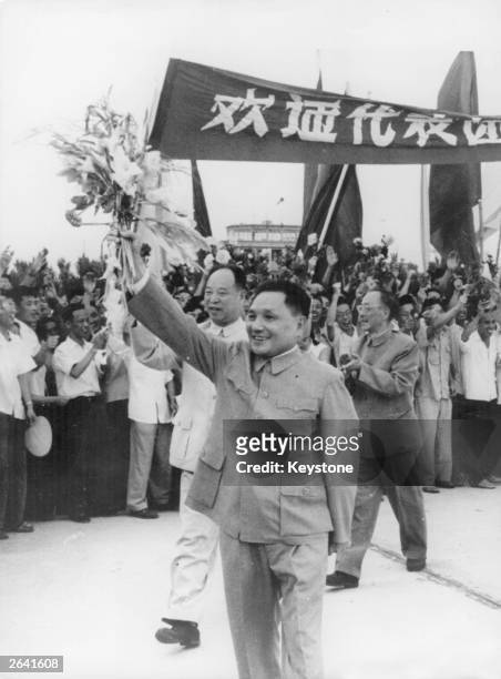 Deng Xiaoping, the old style Chinese communist politician receiving a rapturous greeting from the crowds.