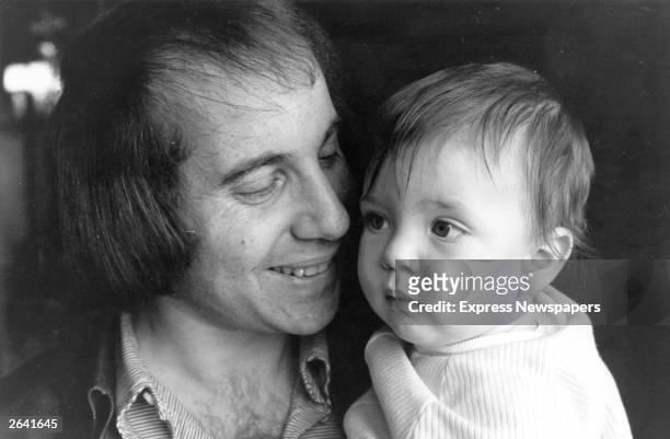 Singer, songwriter and guitarist Paul Simon, famous for his partnership with Art Garfunkel. He is pictured with his son Harper.