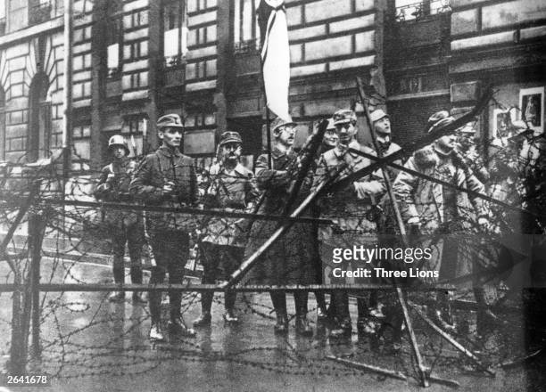 Nazi Party member Heinrich Himmler , holding a flag, with a group of Nazi paramilitaries during the Beer Hall Putsch, the Nazi Party's failed coup...