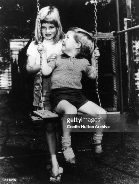 Lady Diana Frances Spencer , playing with her brother Charles Edward Maurice, the Viscount Althorp, in the grounds of Park House, Sandringham when...