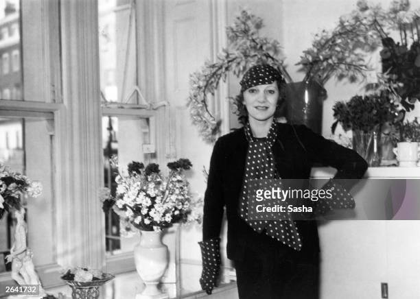 British actress Gertrude Lawrence at the flower shop she has opened in London's Berkeley Square with Lady Diana Cooper.