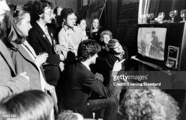 American supporters of the Democratic Party watch television and wait for the result of the 1976 presidential elections in which Jimmy Carter beat...