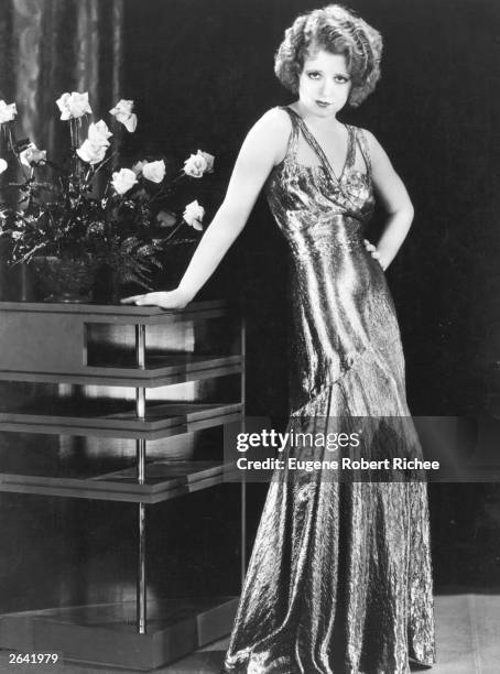 Silent screen siren Clara Bow popularly known as the 'It' girl, wears a silver lame dress for the Paramount film 'No Limit', directed by Frank Tuttle.