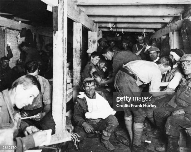 British tommies relaxing and having wounds treated in an underground forward dressing station by the Menin Road in France.