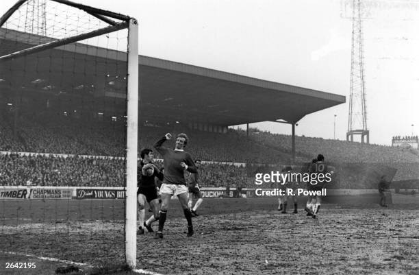 Scottish footballer Denis Law , during a match for Manchester United against Chelsea, after a failed goal attempt. Original Publication: People Disc...