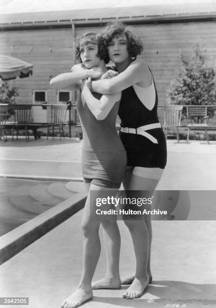 Bathing beauties Andrea Sayley and Margaret Oliver, two of Mack Sennett's bathing girls, demonstrate how to save someone from drowning.