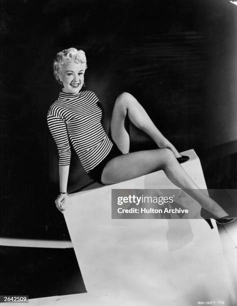 Actress, singer and dancer Betty Grable stars in the Columbia musical 'Three for the Show', directed by H C Potter. As a publicity stunt her legs...