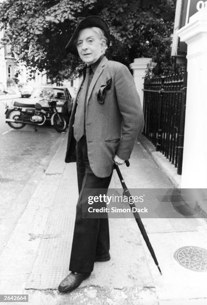 Quentin Crisp , author of 'The Naked Civil Servant', poses near his Chelsea bed-sit.