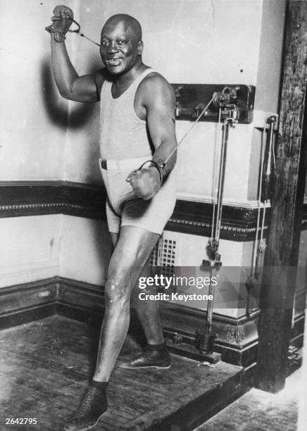 The US boxer Jack Johnson, , training.