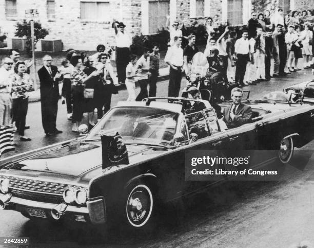 The Presidential motorcade with Texas governor John Connally, first lady Jackie Kennedy and President John F. Kennedy on November 21, 1963 in San...