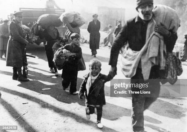 Refugees from the Spanish Civil War cross into France at Le Perthus.
