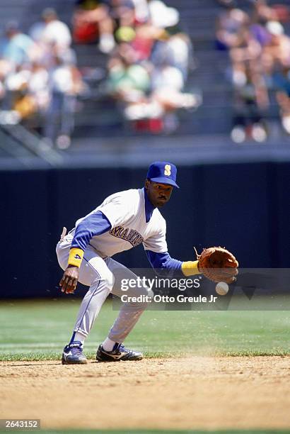 Harold Reynolds of the Seattle Mariners runs prepares to field a ground ball during a game against the Oakland Athletics in the 1991 MLB season game...