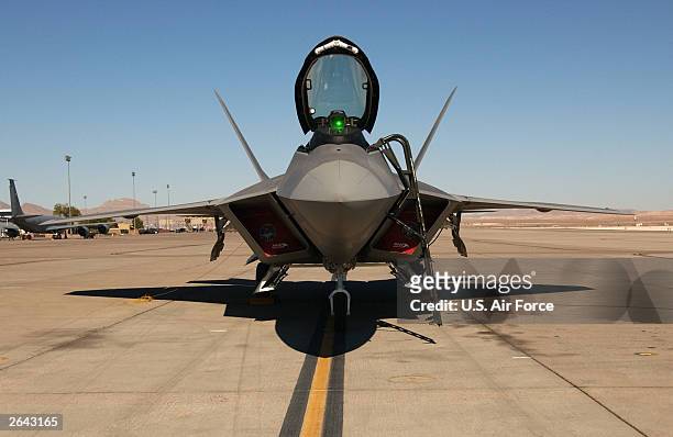 Lockheed Martin F/A-22 sits on the parking ramp October 22, 2003 at Nellis Air Force Base, Nevada. The F/A-22 Raptor is a new breed of super-fighter...