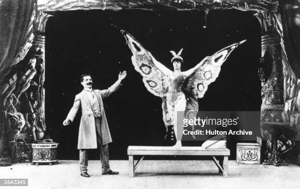 French actor, magician, designer and theatre manager Georges Melies in a film in which he turns a sleeping woman into a butterfly.
