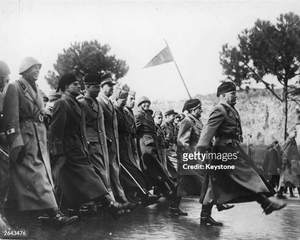 Mussolini leading Fascist officials marching to the 'Goose Step', during a parade of Fascist Militia in Rome.