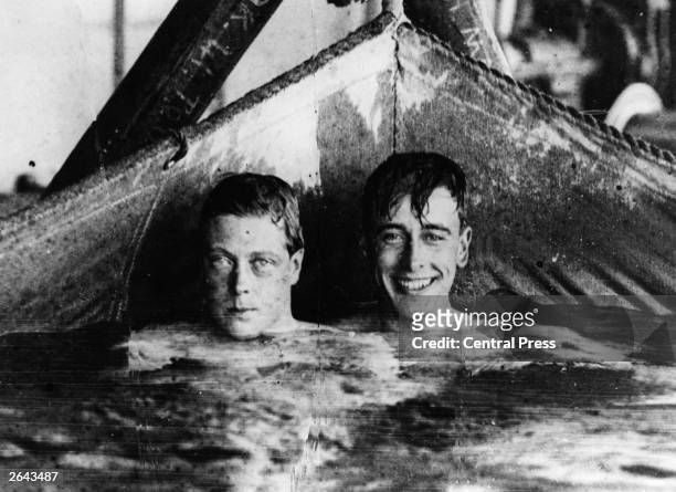 The Prince of Wales and Lord Louis Mountbatten in a canvas swimming pool on board HMS Renown, circa 1920.
