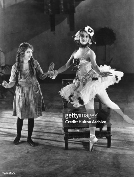 Anna Pavlova and Mary Pickford on the set of the 'Thief of Baghdad' in Hollywood. The film was directed by Raoul Walsh for Douglas Fairbanks Pictures.