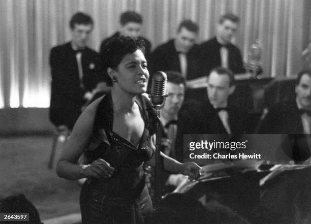 American jazz singer Billie Holiday , also known as 'Lady Day', during a performance. Original Publication: Picture Post - 7380 - Billie Holiday -...