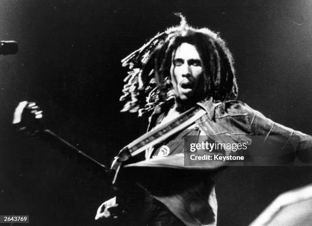 Bob Marley the Jamaican born singer, guitarist and composer in concert.