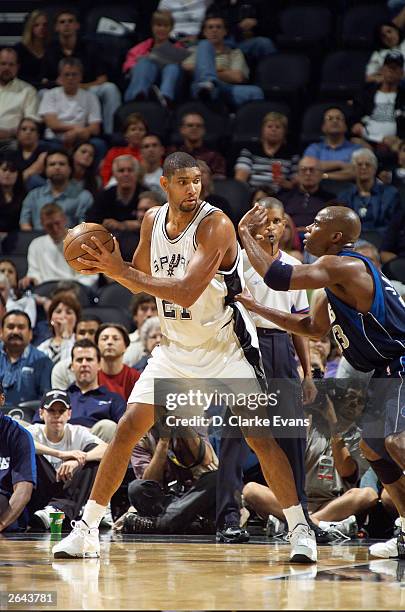 Tim Duncan the San Antonio Spurs guards the ball from Antawn Jamison of the Dallas Mavericks during the preseason game at SBC Center on October 19,...