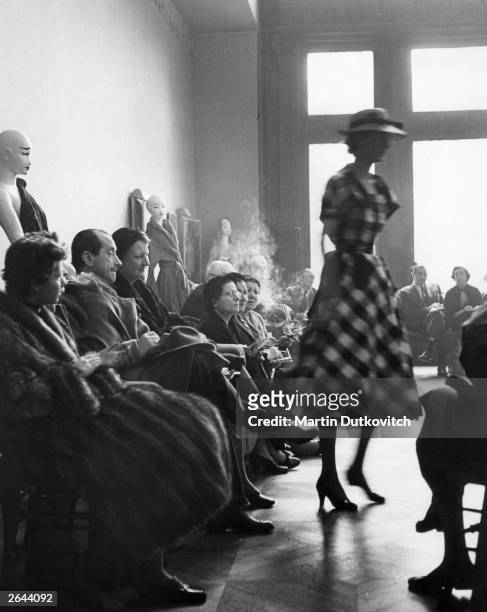 Buyers view the first fashion show by Hubert de Givenchy in Paris. Original Publication: Picture Post - Fashion's New Boy - pub 1952