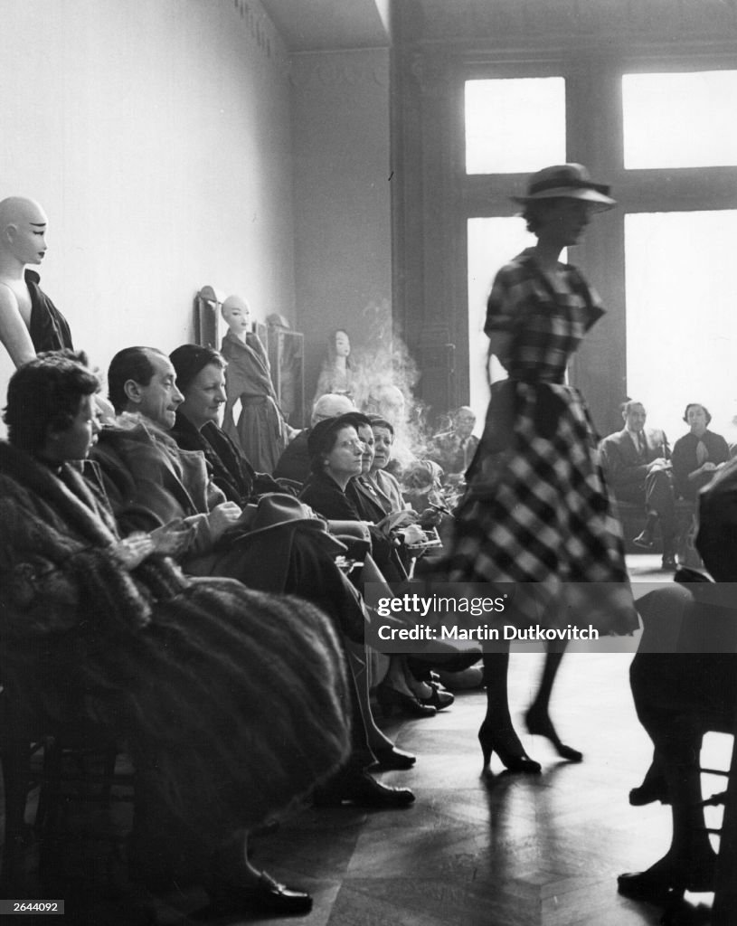 Buyers view the first fashion show by Hubert de Givenchy in Paris