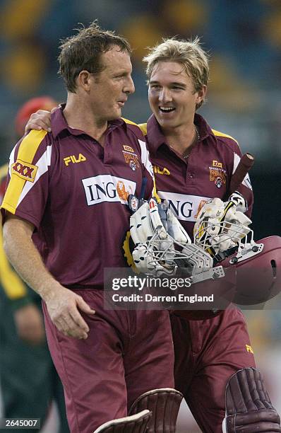 Wade Seccombe and Nathan Hauritz of the Bulls celebrate winning against the Tigers during the ING Cup match between the Queensland Bulls and the...